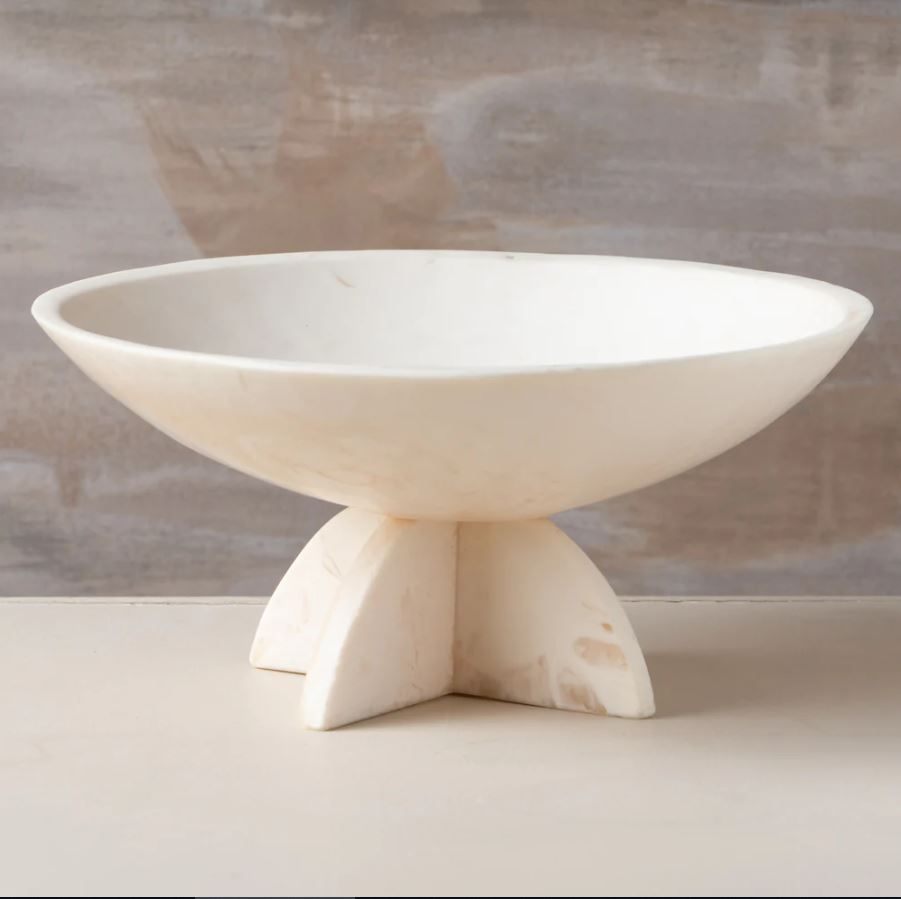 a white bowl sitting on top of a table