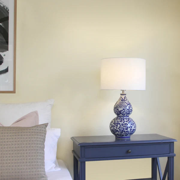 a blue table with a lamp on top of it