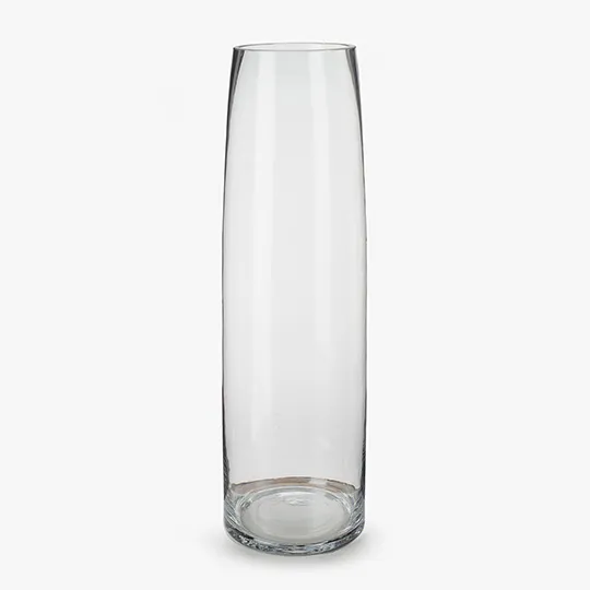 a tall glass vase sitting on top of a table