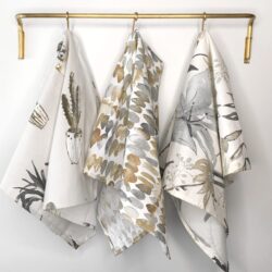 three towels hanging on a towel rack