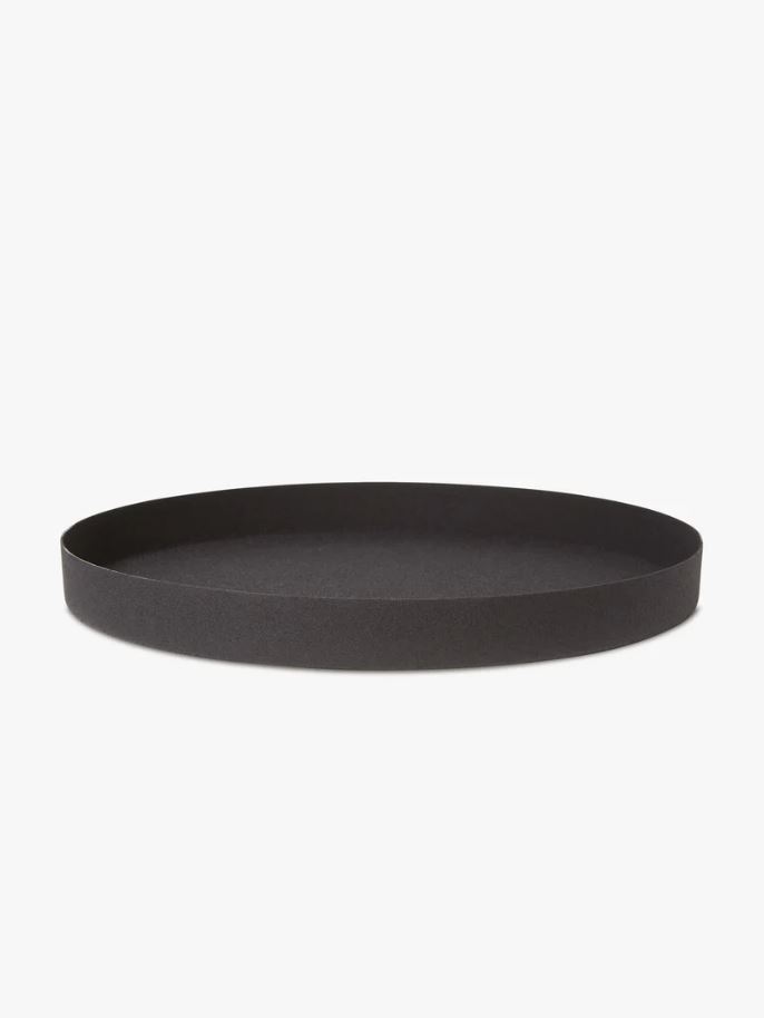 black metal tray round design on tabletop