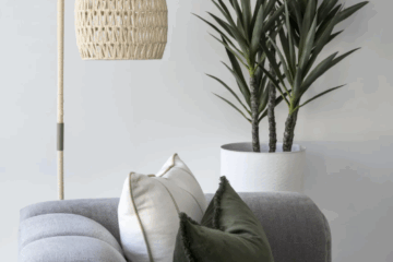 Neutral living room with timber furniture and indoor plants, reflecting natural elements in interior design