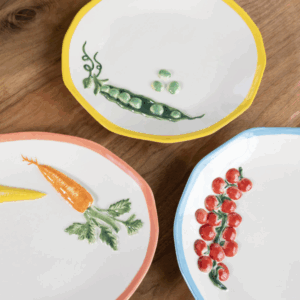 Ceramic serving platter Pomodoro styled on dining table