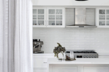 Minimalist interior living room with neutral tones, natural textures and soft lighting, designed by Tailored HQ.