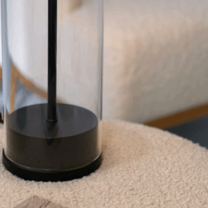 Ira Table Lamp in black with a modern silhouette and warm diffused light