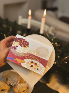 Merry Christmas Pavlova Card flat lay on neutral background