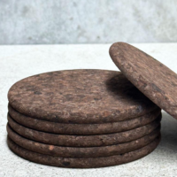Cork coaster set Australia showing all four dark cork round coasters laid flat