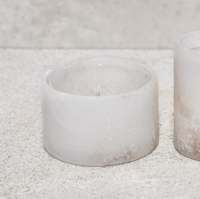 Large alabaster candle holder unlit showing natural stone veining and translucent surface