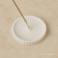 Scallop incense holder styled in home decor setting with incense